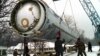 Soldiers prepare to destroy a ballistic SS-19 missile in the yard of the largest former Soviet military rocket base in Vakulenchuk, 220 kilometers (137 miles) west of Kyiv, Dec. 24, 1997. 