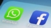 FILE - WhatsApp and Facebook app icons on a smartphone in New York. 