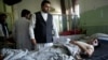Wounded men lie on their beds in Wazir Akbar Khan Hospital in Kabul, Afghanistan, May 31, 2017. A massive explosion rocked a highly secure diplomatic area of Kabul Wednesday morning, causing casualties and sending a huge plume of smoke over the Afghan capital.