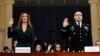 Jennifer Williams, an aide to Vice President Mike Pence, left, and National Security Council aide Lt. Col. Alexander Vindman, are sworn in to testify before the House Intelligence Committee on Capitol Hill in Washington, Nov. 19, 2019, during a public imp