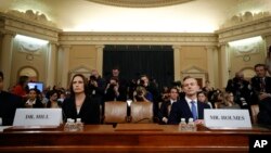 Former White House national security aide Fiona Hill, and David Holmes, a U.S. diplomat in Ukraine, arrive to testify before the House Intelligence Committee on Capitol Hill in Washington, Thursday, Nov. 21, 2019, during a public impeachment hearing of Pr