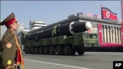 In this image made from video by North Korea's KRT, a military parade is held in Pyongyang, North Korea, Feb. 8, 2018. North Korea's intercontinental ballistic missiles highlighted the event.