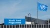 FILE - A World Food Program's flag flutters on the roof of WFP's headquaters after the WFP won the 2020 Nobel Peace Prize, in Rome, Italy, Oct. 9, 2020.