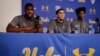 UCLA basketball player Cody Riley, left, reads his statement as he is joined by teammates LiAngelo Ball, center, and Jalen Hill during a news conference at UCLA, Nov. 15, 2017, in Los Angeles. 