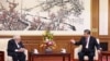 Chinese President Xi Jinping and Henry Kissinger, former U.S. secretary of state, attend a meeting in Beijing