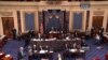 This handout video image shows former Senate Majority Leader Bob Dole, right, in the Senate Chamber on Capitol Hill, Dec. 4,2012, by his wife Elizabeth Dole. Frail and in a wheelchair, Dole was a startling presence on the Senate floor as lawmakers voted on a treaty on disabilities.