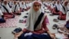 Indian Muslim students practice yoga at a school ahead of first International Yoga Day in Ahmadabad, India, Wednesday, June 17, 2015. 
