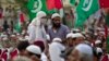 FILE - Supporters of banned sectarian group Sipah-e-Sahaba listen to their leaders at a gathering in Islamabad, Pakistan, Oct. 4, 2013. Pakistan's DAWN newspaper says that 41 of the 64 extremist organizations banned by the government operate freely online