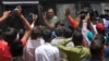 An Indian man convicted for the 2002 Gujarat riots is taken back to jail after the court announced the lengths of the sentences in Ahmadabad, India on June 17, 2016.