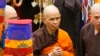 FILE - Vietnamese Zen master Thich Nhat Hanh, center, arrives for a great chanting ceremony at Vinh Nghiem Pagoda in Ho Chi Minh City, Vietnam, March 16, 2007.