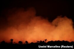 Smoke billows during a fire in an area of the Amazon rainforest near Humaita, Amazonas State, Brazil, Brazil August 17, 2019. Picture Taken August 17, 2019. REUTERS/Ueslei Marcelino