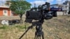 The damaged camera of pan-Arab TV network Al-Mayadeen cameraman Rabih Maamari, who was killed in an Israeli strike, is seen at the Lebanese border village of Tair Harfa near the border with Israel, Tuesday, Nov. 21, 2023.