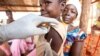 FILE - A child is given a measles vaccination during an emergency campaign run by Doctors Without Borders (MSF) in Likasa, Mongala province in northern Democratic Republic of Congo.