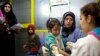 FILE - A Syrian girl cries after being vaccinated against the measles at a U.N. registration center in Zahleh, in Lebanon's Bekaa Valley.