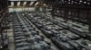 Dozens of German-made Leopard 1 tanks and other armoured vehicles are seen in an hangar in Tournais.