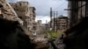 FILE - Damaged buildings at al-Amriya frontline in Aleppo, March 3, 2015.
