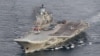 FILE - A photo taken from a Norwegian surveillance aircraft shows Russian aircraft carrier Admiral Kuznetsov in international waters off the coast of northern Norway, Oct. 17, 2016. The carrier will reportedly be used as part of a Russian aerial assault on rebel-held parts of Aleppo.