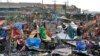 Residents salvage what's left of their homes damaged by Typhoon Rai in Cebu city, central Philippines on Dec. 17, 2021.