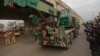 An Indian army truck carrying military equipment moves towards the Indian air force base in Pathankot, India, Monday, Jan. 4, 2016.