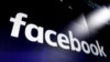 FILE - The logo for social media giant Facebook appears on screens at the Nasdaq MarketSite, in New York's Times Square, March 29, 2018.