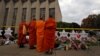 Monks pay their respects at a makeshift memorial outside the Tree of Life synagogue following Saturday's shooting at the synagogue in Pittsburgh, Penn., Oct. 29, 2018. 