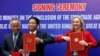 Britain's International Trade Secretary Liz Truss and Vietnam's Minister of Industry and Trade Tran Tuan Anh at a Hanoi signing ceremony of a free trade deal, Dec11, 2020. 
