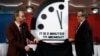 Robert Rosner, chairman of the Bulletin of the Atomic Scientists, right, and Bulletin of the Atomic Scientists member Lawrence Krauss, left, unveil the Doomsday Clock during a news conference at the National Press Club in Washington, Jan. 25, 2018. 