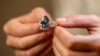 This photograph taken on Nov. 2, 2023 in Geneva, shows "Bleu Royal," a rare 17,61 carats internally flawless fancy vivid blue pear shaped diamond that sold for $43.8 million at a Christie's sale of rare jewels in Geneva on Tuesday.