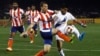 FILE - Diego Fernando Nadaya (R) of Mumbai City FC fights for the ball with Jose Miguel Gonzalez Rey (2nd R) of Atletico de Kolkata during the opening match of the Indian Super League soccer tournament at Salt Lake stadium in Kolkata, Oct. 12, 2014. 