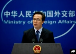 FILE - Foreign Ministry spokesman Hong Lei speaks during a press briefing in Beijing, China.