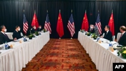 U.S. Secretary of State Antony Blinken, second right, and Chinese Foreign Minister Wang Yi, left, lead their delegations in U.S.-China talks in Anchorage, Alaska, March 18, 2021.