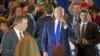 Republican presidential candidate Donald Trump walks through the buffer as he mixes with supporters mid-speech during a campaign stop at the Savannah Center, March 13, 2016, in West Chester, Ohio. 
