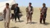 Members of an Afghan militia look on during fighting between Taliban militants and Afghan security forces near the Qala-e-Zal district in Kunduz province, May 7, 2017.