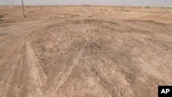 A desert area with scattered plots of agricultural land with features that closely matched the description of the al-Qadisiyah battle site described in historic texts, Nov. 10, 2024.