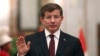 FILE - Turkey's Prime Minister Ahmet Davutoglu speaks to reporters in Baghdad, Nov. 20, 2014.