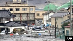 Plimski talas koji se javio posle zemljotresa u Japanu poplavio je mnoga priobalna područja, uključujući Kesenuma, u okrugu Mijagi
