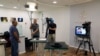 FILE - Employees work inside the offices of Qatar-based Al Jazeera network in Jerusalem, Israel, Aug. 7, 2017. Israel's communications minister said the decision to shut down Al Jazeera's local news bureau is awaiting approval from the country's defense minister.