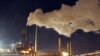 Smoke bellows from a chimney stack at BlueScope Steel's steelworks at Port Kembla, south of Sydney, Australia, 1 Jul, 2012.