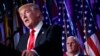 President-elect Donald Trump speaks as Vice president-elect Mike Pence watches during an election night rally in New York, Nov. 9, 2016.