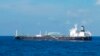 In this undated photo released by the Indonesian Navy on Wednesday, Aug. 25, 2021, the Bahamas-flagged tanker MT Strovolos is seen in the waters off Riau Islands, Indonesia. (Indonesian Navy via AP)