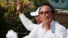 Opposition party Cambodia National Rescue Party (CNRP) President Kem Sokha greets his supporters from a truck as he leads a rally during the last day of campaigning ahead of communal elections in Phnom Penh, Cambodia, Friday, June 2, 2017. Cambodia's longtime ruler Hun Sen warned opposition parties Friday not to challenge the result of Sunday's local elections or they could be dissolved. (AP Photo/Heng Sinith)