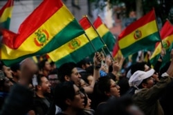 Anti-government protesters march against early presidential election results in La Paz, Bolivia, Oct. 22, 2019.