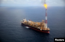 FILE - Kaombo Norte floating oil platform is seen from a helicopter off the coast of Angola, Nov. 8, 2018.