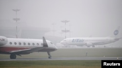 FILE - Planes are seen on the tarmac at Moscow's Vnukovo airport.