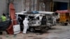 PakistanPakistani investigators examine damage vehicles at the site of suicide bombing in Lahore, Pakistan, April 5, 2017.