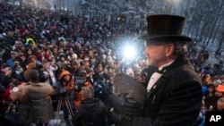Groundhog Club co-handler John Griffiths holds Punxsutawney Phil, the weather prognosticating groundhog, during the 134th celebration of Groundhog Day on Gobbler's Knob in Punxsutawney, Pa. Feb. 2, 2020. 