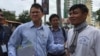 Ny Chakrya, a former official of ADHOC official and National Election Committee, talks to former RFA journalist after leaving the Phnom Penh Municipal Court, August 27, 2018. 