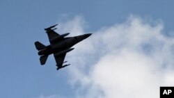 FILE - A Turkish fighter jet flies above the Incirlik airbase in southern Turkey.
