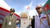 FILE PHOTO - A Cambodian army officer, left, and a Vietnamese army officer stand in front of a newly launched border mark (on the Cambodian side) in between Gia Lai province of Vietnam and Rattanakiri of Cambodia on Saturday, Dec. 26, 2015. 