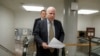 Senator John McCain, a member of the Senate Foreign Relations Committee, heads to the chamber to advance a bill providing $1 billion in loan guarantees to Ukraine, March 24, 2014. 